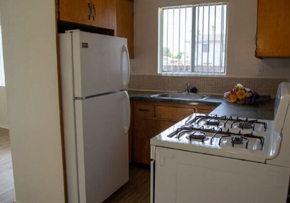 Kitchens include refrigerator, stove and garbage disposal